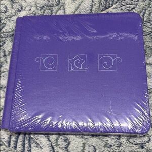 7x7 Purple HardcoverScrapbook with Decorative star/swirl Design and pages includ